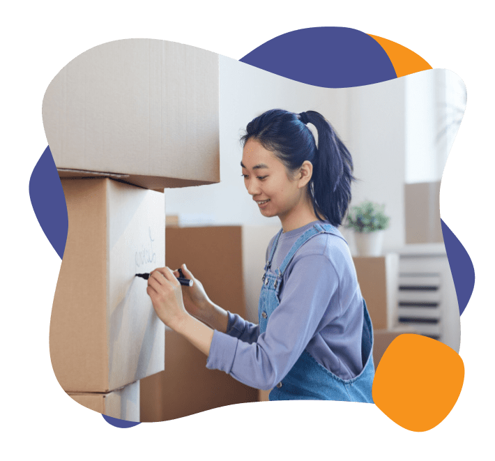 Woman packing boxes for moving getting ready for move-in move-out cleaning services